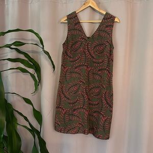 Halogen shift dress in olive with coral and black decoration.